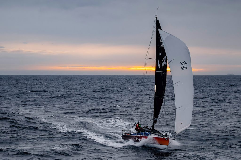 In this photo provided by the Cruising Yacht Club of Australia, the boat Min River is sailed by Jiang Lin and Alexis Loison near Hobart, Australia, Tuesday, Dec. 30, 2025, as they finish the Sydney Hobart yacht race. (Kurt Arrigo/CYCA via AP)