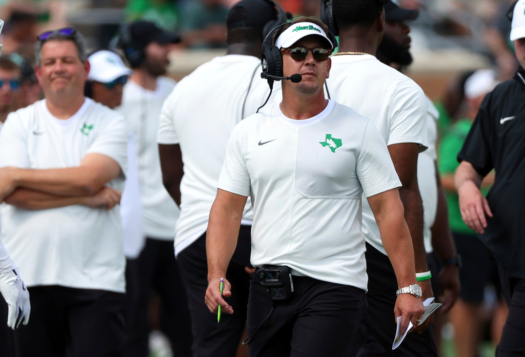 FILE - North Texas head coach Eric Morris walks the sideline during an NCAA college football game against Washington State, Sept. 13, 2025, in Denton, Texas. (AP Photo/Richard W. Rodriguez, file)