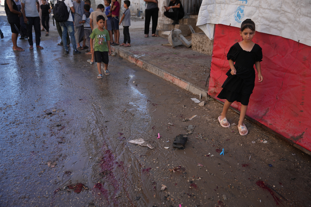 Palestinians inspect the site of an Israeli airstrike in Nuseirat, central Gaza Strip, Friday, July 17, 2026. (AP Photo/Abdel Kareem Hana)