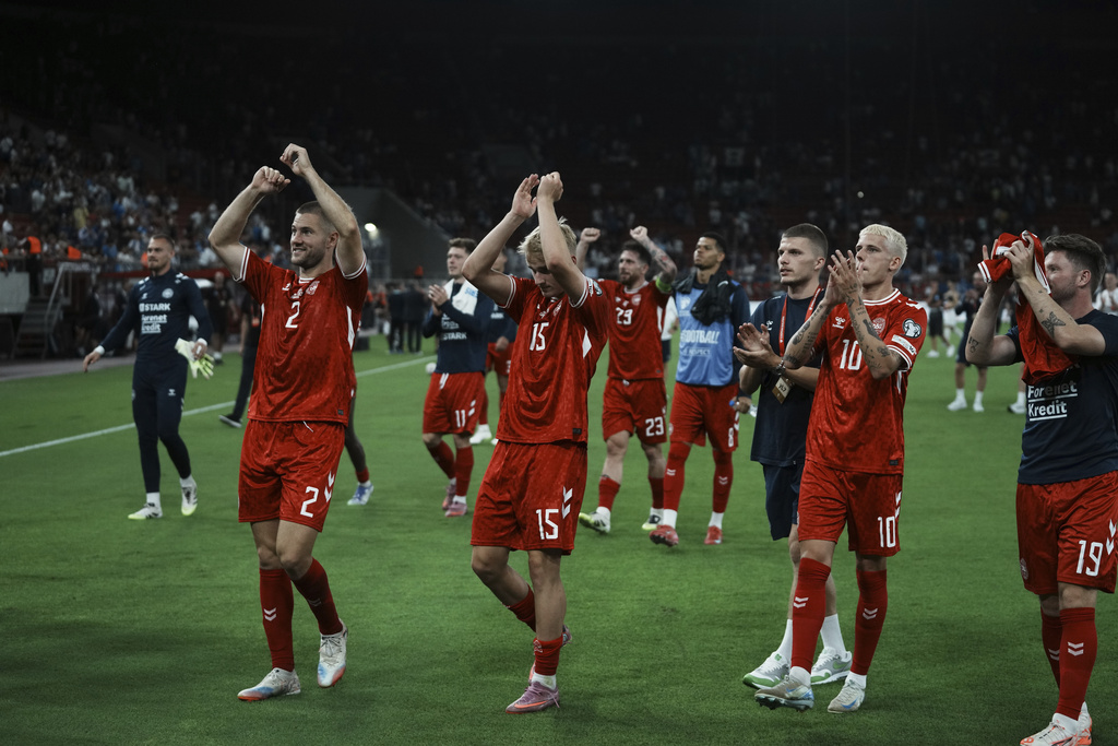 Danish players celebrate after a World Cup qualifying soccer match between Greece and Denmark at Georgios Karaiskakis stadium in Piraeus port, near Athens, Monday, Sept. 8, 2025. (AP Photo/Thanassis Stavrakis)