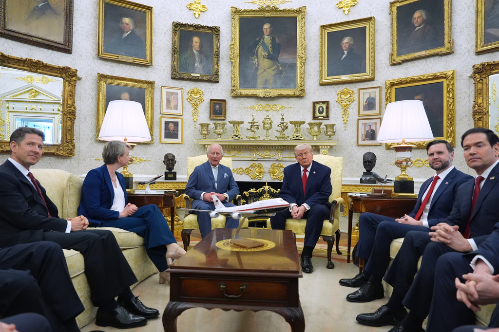 President Donald Trump and Britain's King Charles III meet in the Oval Office of the White House, Tuesday, April 28, 2026, in Washington, during a State Visit, with Britain's Ambassador to the U.S. Christian Turner, Britain's Foreign Secretary Yvette Cooper, Vice President JD Vance and Secretary of State Marco Rubio. (AP Photo/Alex Brandon)