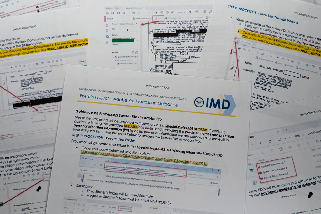 A document that was included in the U.S. Department of Justice release of the Jeffrey Epstein files, photographed Tuesday, Feb. 10, 2026, shows Department of Justice instructions for redacting Epstein files. (AP Photo/Jon Elswick)