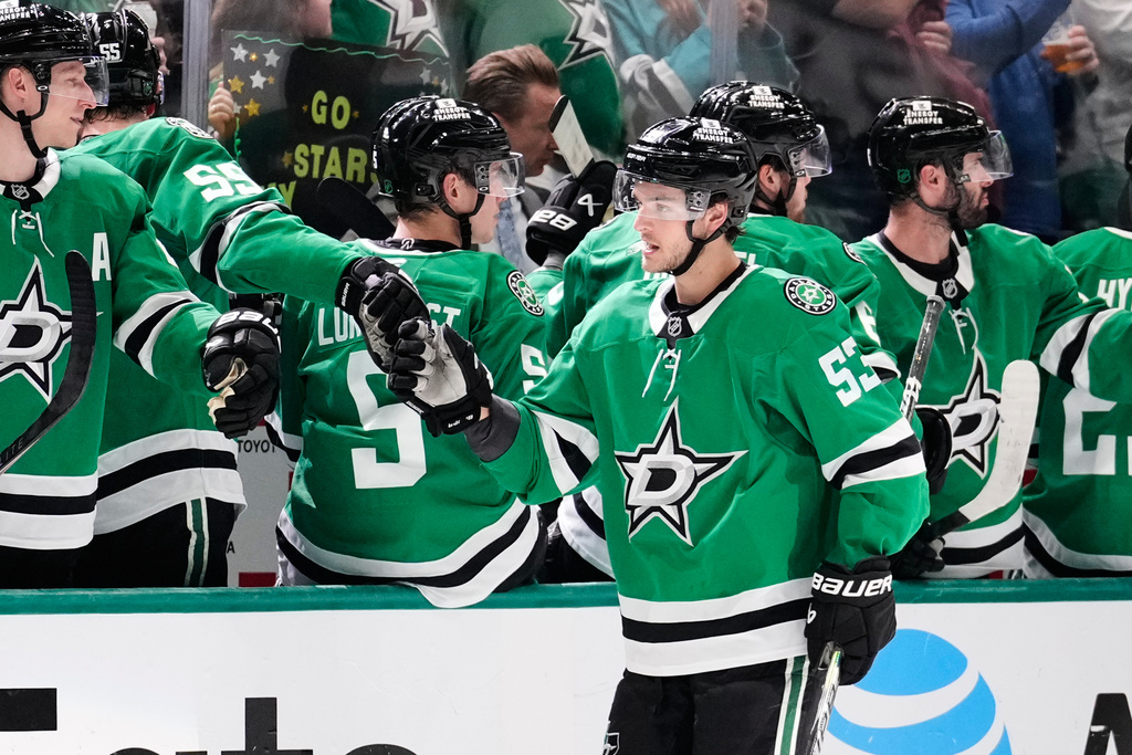 Dallas Stars center Wyatt Johnston (53) celebrates with teammates after scoring in the second period of an NHL hockey game against the Seattle Kraken in Dallas, Wednesday, Feb. 25, 2026. (AP Photo/Tony Gutierrez)