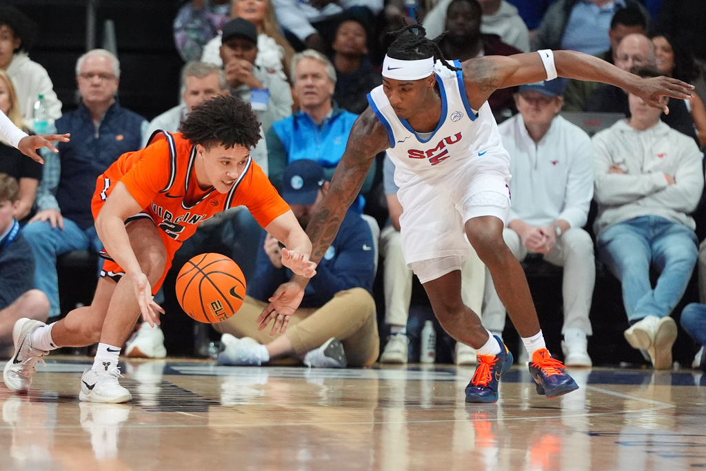 Virginia guard Chance Mallory (2) and SMU guard Jaron Pierre Jr. (5) reach for the ball during the second half of an NCAA college basketball game Saturday, Jan. 17, 2026, in Dallas. (AP Photo/LM Otero)