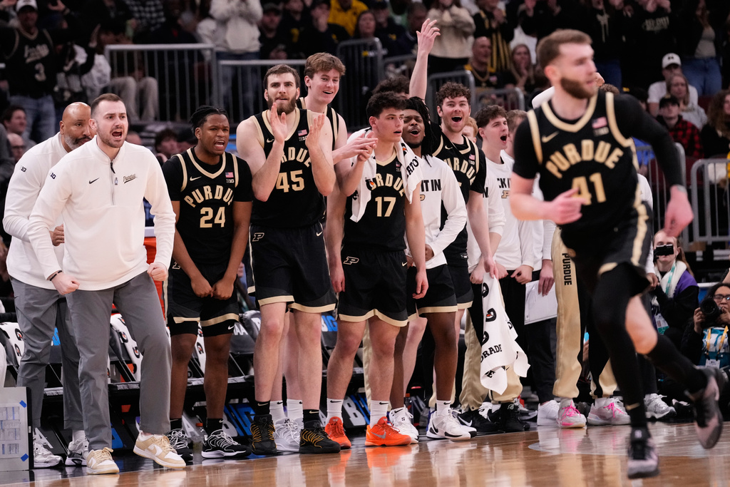 Purdue players celebrate after guard Braden Smith scored a basket during the second half of an NCAA college basketball game against Michigan in the championship of the Big 10 Conference tournament, Sunday, March 15, 2026, in Chicago. (AP Photo/Nam Y. Huh)
