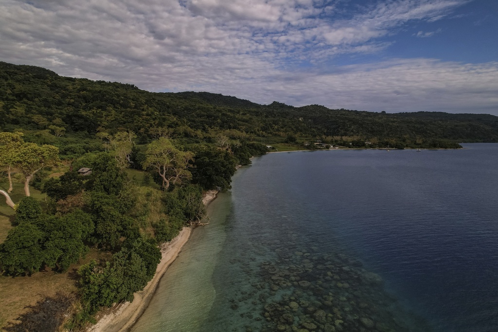 FILE -Corals dot the coastline of Efate Island, Vanuatu, July 20, 2025. (AP Photo/Annika Hammerschlag), File)
