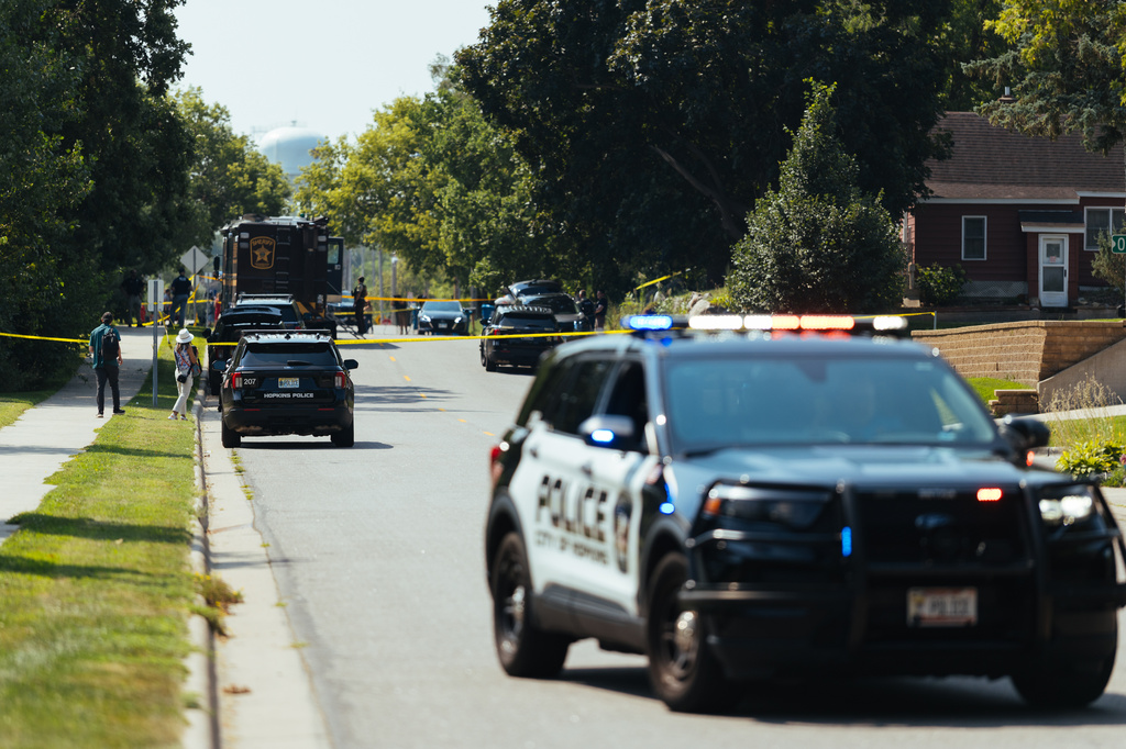 Law enforcement respond to a call at a home daycare, Wednesday, Aug. 12, 2026, in Hopkins, Minn. (AP Photo/Carly Danek)