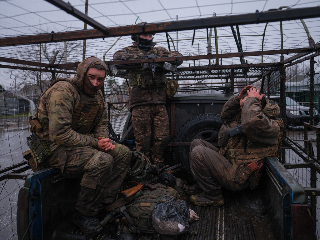 In this photo provided by Ukraine's 93rd Kholodnyi Yar Separate Mechanized Brigade press service, soldiers return from their mission in Donetsk region, Ukraine, Saturday, Jan. 31, 2026. (Iryna Rybakova/Ukraine's 93rd Mechanized Brigade via AP)