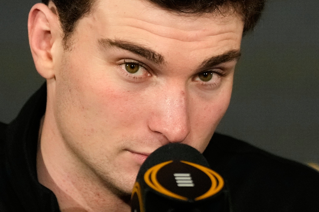 Indiana quarterback Fernando Mendoza speaks during the champions news conference after theiir win against Miami in the College Football Playoff national championship game, Tuesday, Jan. 20, 2026, in Miami. (AP Photo/Chris Carlson)