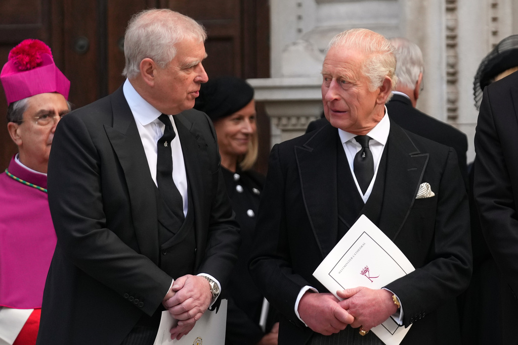 FILE - Britain's Prince Andrew, left, and Britain's King Charles III leave after the Requiem Mass service for the Duchess of Kent at Westminster Cathedral in London, Sept. 16, 2025. (AP Photo/Joanna Chan, File)