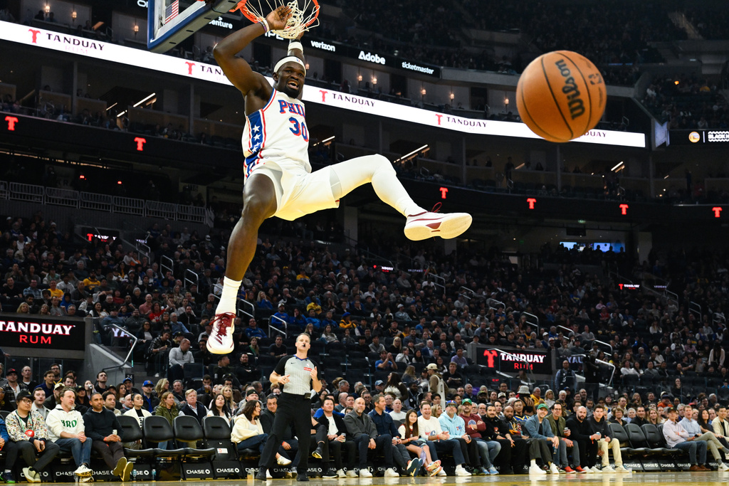 Philadelphia 76ers center Adem Bona dunks against the Golden State Warriors during the first half of an NBA basketball game Tuesday, Feb. 3, 2026, in San Francisco. (AP Photo/Eakin Howard)