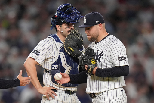 New York Yankees pitcher David Bednar, right, leaves the game after giving up an RBI double to the Boston Red Sox during the ninth inning of Game 1 of an American League wild-card baseball playoff series, Tuesday, Sept. 30, 2025, in New York. (AP Photo/Frank Franklin II) New York Yankees pitcher David Bednar, right, leaves the game after giving up an RBI double to the Boston Red Sox during the ninth inning of Game 1 of an American League wild-card baseball playoff series, Tuesday, Sept. 30, 2025, in New York. (AP Photo/Frank Franklin II)