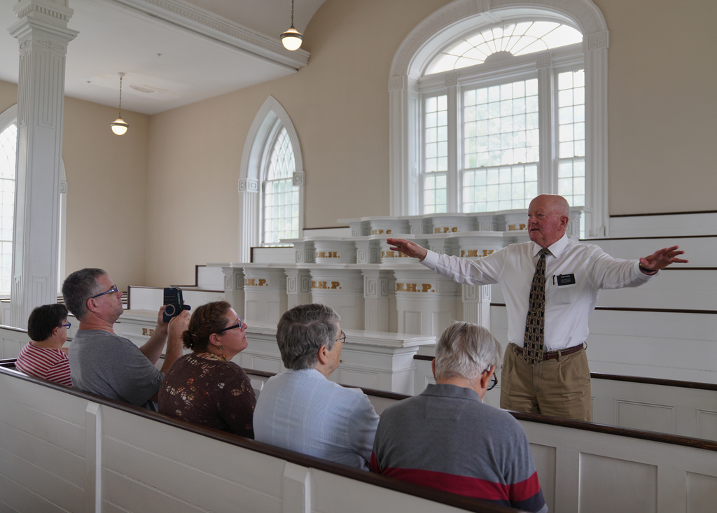 Elder Brian Garner leads a tour of the Kirtland temple site, a nearly two-century old sanctuary considered the first temple in the movement Joseph Smith founded, on Wednesday, June 15, 2026, in Kirtland, Ohio. (AP Photo/Jessie Wardarski)