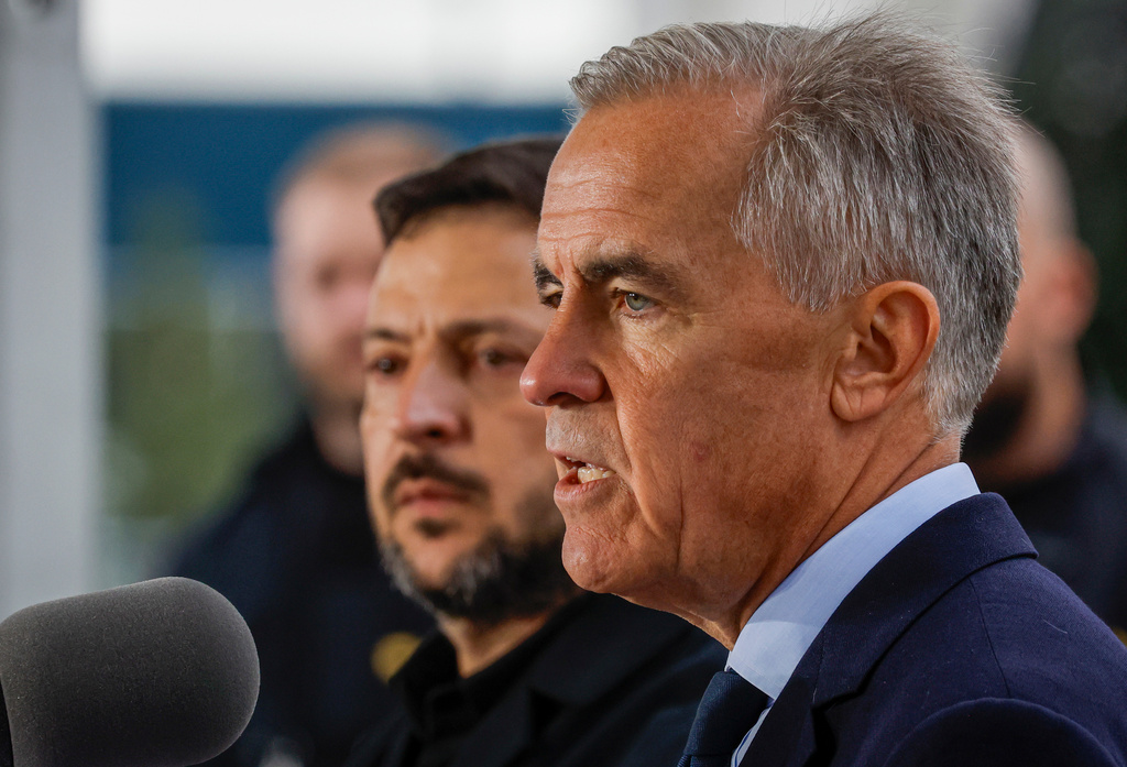 Canadian Prime Minister Mark Carney, right, and Ukraine's President Volodymyr Zelenskyy, speak after signing agreements in Calgary, Alberta, Canada, Thursday, Sept. 10, 2026. (Jeff McIntosh/The Canadian Press via AP)
