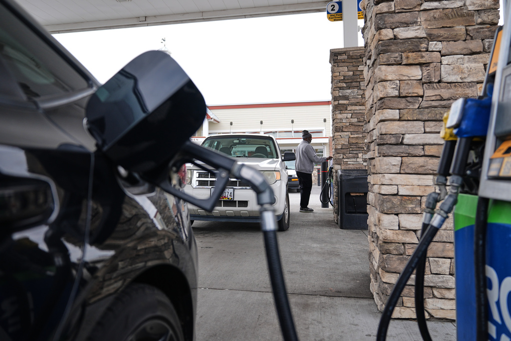FILE - A person fuels their vehicle at a gas station March 19, 2026, in Baltimore. (AP Photo/Stephanie Scarbrough, File)