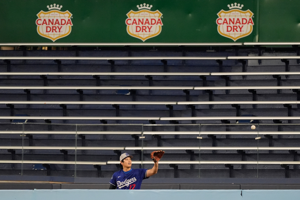 Los Angeles Dodgers' Shohei Ohtani throws in the bullpen during a World Series baseball media day, Thursday, Oct. 23, 2025, in Toronto. The Toronto Blue Jays face the Los Angeles Dodgers in Game 1 on Friday. (AP Photo/Brynn Anderson)