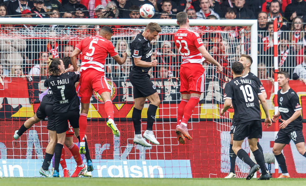 Union Berlin's Andrej Ilic, center right, scores during the Bundesliga soccer match between Union Berlin and St. Pauli, in Berlin, Sunday April 5, 2026. (Andreas Gora/dpa via AP)