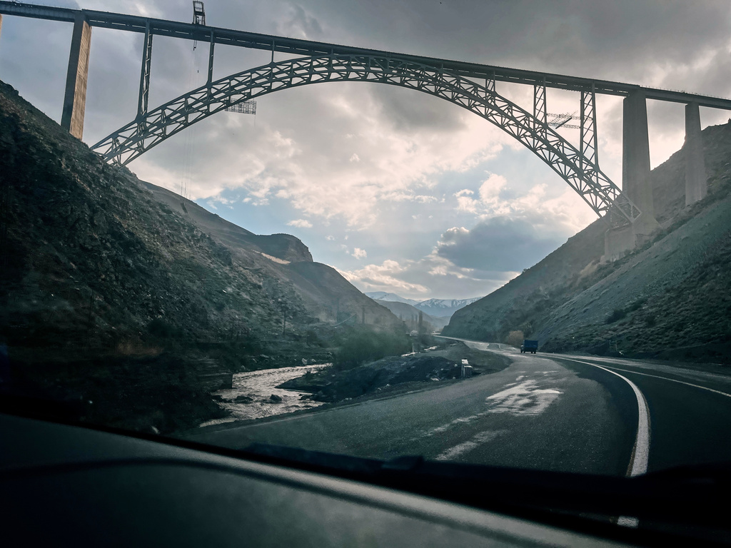 Road 32 stretches toward the Turkish border beneath Khoy Bridge near Razi, Iran, Thursday, April 9, 2026. (AP Photo/Francisco Seco)