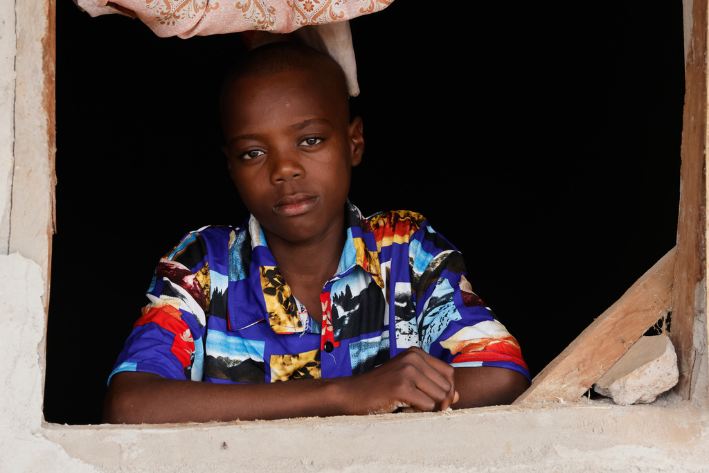 Onyeka Chieme, a student of St. Mary's Catholic School, abducted by gunmen and later released, poses for a photograph at his house in Papiri, Nigeria, Wednesday, Dec. 10, 2025. (AP Photo/Afolabi Sotunde)