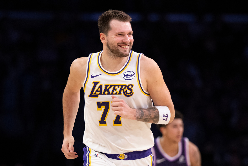 Los Angeles Lakers guard Luka Doncic smiles during the first half of an NBA basketball game against the Sacramento Kings in Los Angeles, Sunday, March 1, 2026. (AP Photo/Kyusung Gong)