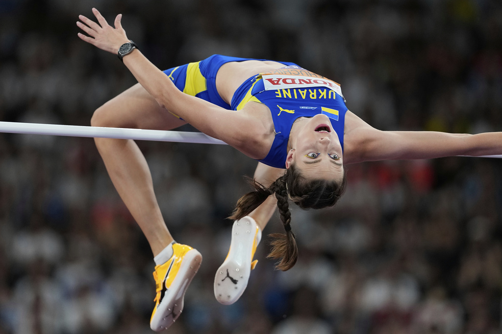 Ukraine's Yaroslava Mahuchikh competes in the women's high jump final at the World Athletics Championships in Tokyo, Sunday, Sept. 21, 2025. (AP Photo/Ashley Landis)