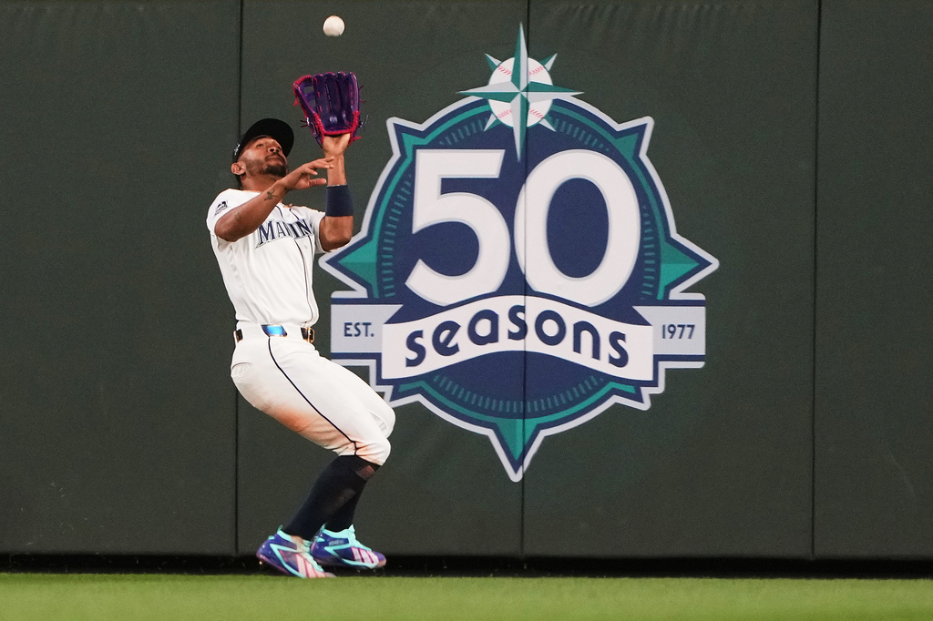 Seattle Mariners center fielder Julio Rodríguez catches a fly ball from Kansas City Royals' Carter Jensen during the sixth inning of a baseball game, Saturday, May 2, 2026, in Seattle. (AP Photo/Lindsey Wasson)