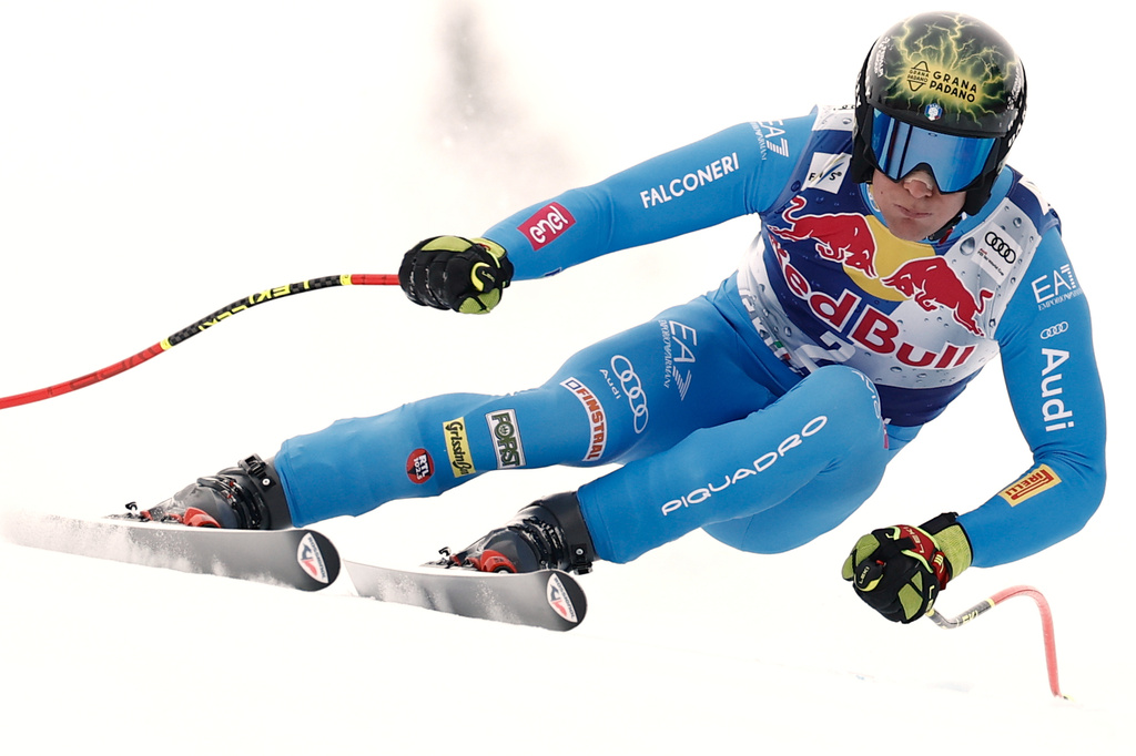 Italy's Giovanni Franzoni speeds down the course during a men's alpine ski World Cup downhill, in Kitzbuehel, Austria, Saturday, Jan. 24, 2026. (AP Photo/Gabriele Facciotti)