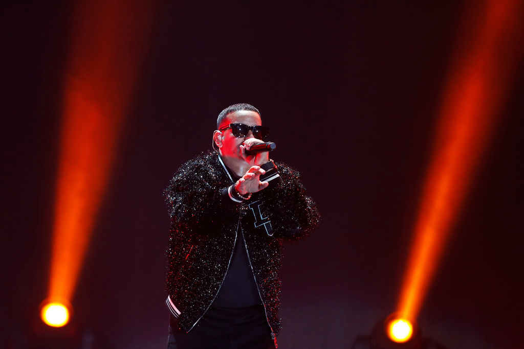 FILE - Daddy Yankee performs at the 2019 iHeartRadio Fiesta Latina, Nov. 2, 2019, in Miami. (AP Photo/Luis M. Alvarez, File)