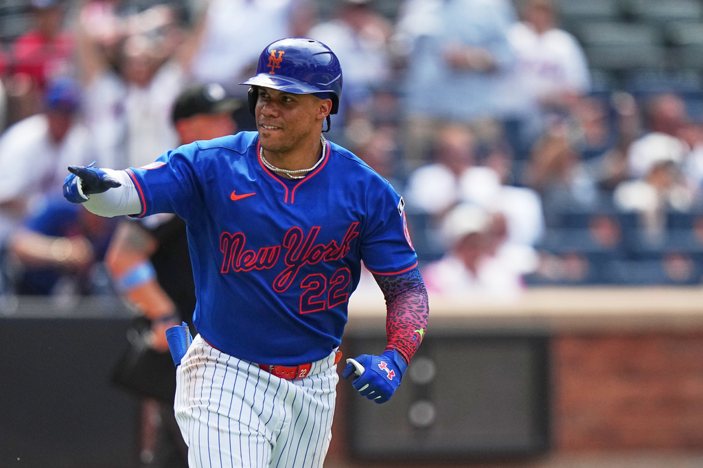 New York Mets' Juan Soto (22) gestures to teammates as he runs the bases after hitting a home run during the seventh inning of a baseball game against the St. Louis Cardinals Thursday, June 11, 2026, in New York. (AP Photo/Frank Franklin II)