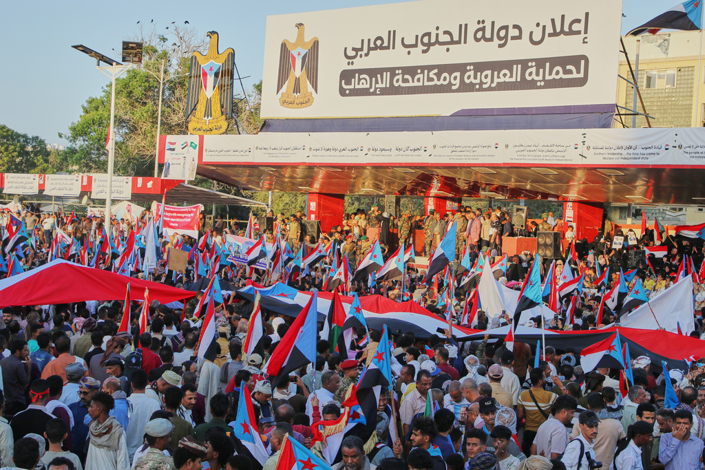 Supporters of the Southern Transitional Council (STC), a coalition of separatist groups seeking to restore the state of South Yemen, hold South Yemen flags during a rally, in Aden, Yemen, Dec. 25, 2025. Arabic reads, "announcement of South Arab state". (AP Photo)