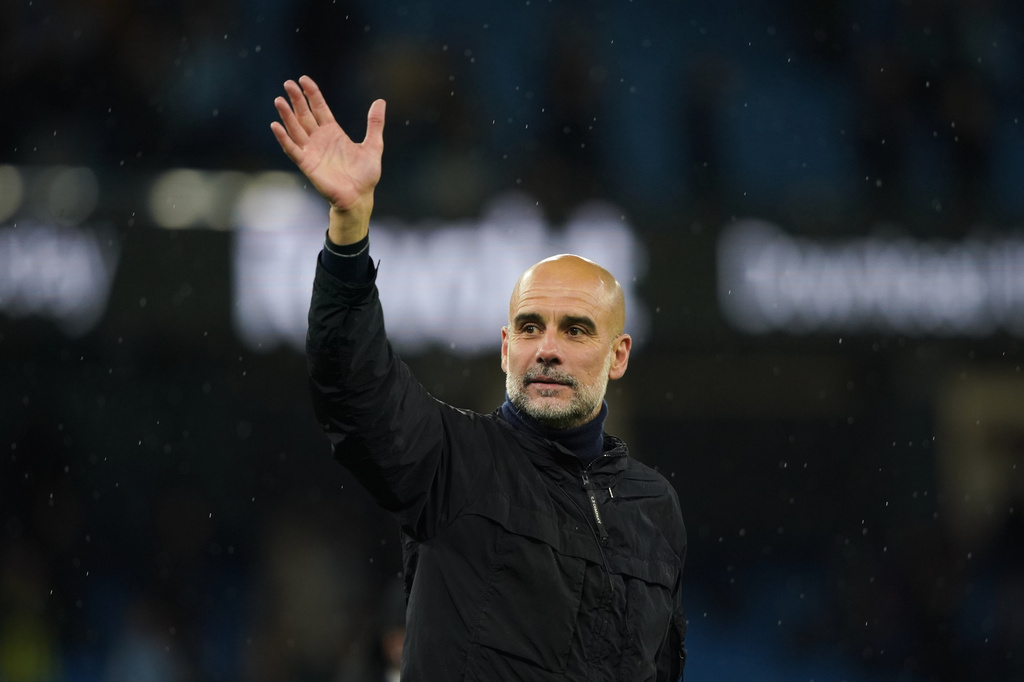 Manchester City's head coach Pep Guardiola greets fans at the end of the English Premier League soccer match between Manchester City and Crystal Palace in Manchester, England, Wednesday, May 13, 2026. (AP Photo/Ian Hodgson)