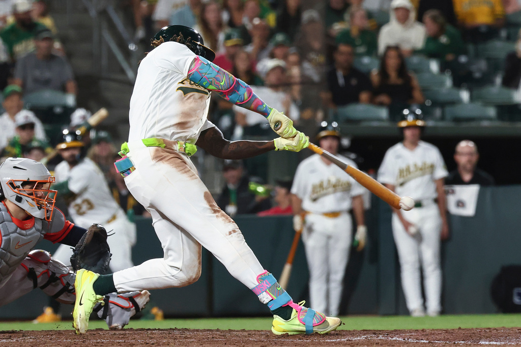 Athletics' Lawrence Butler hits an RBI single on a fielder's choice during the sixth inning of a baseball game against the Houston Astros, Friday, Sept. 25, 2026, in West Sacramento, Calif. (AP Photo/Sara Nevis)