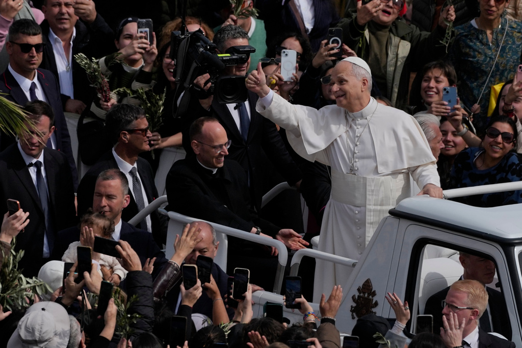 Pope Leo XIV leaves after presiding over Mass in St. Peter's Square at the Vatican on the Catholic feast of Palm Sunday, commemorating Jesus' arrival in Jerusalem, Sunday, March 29, 2026. (AP Photo/Alessandra Tarantino)