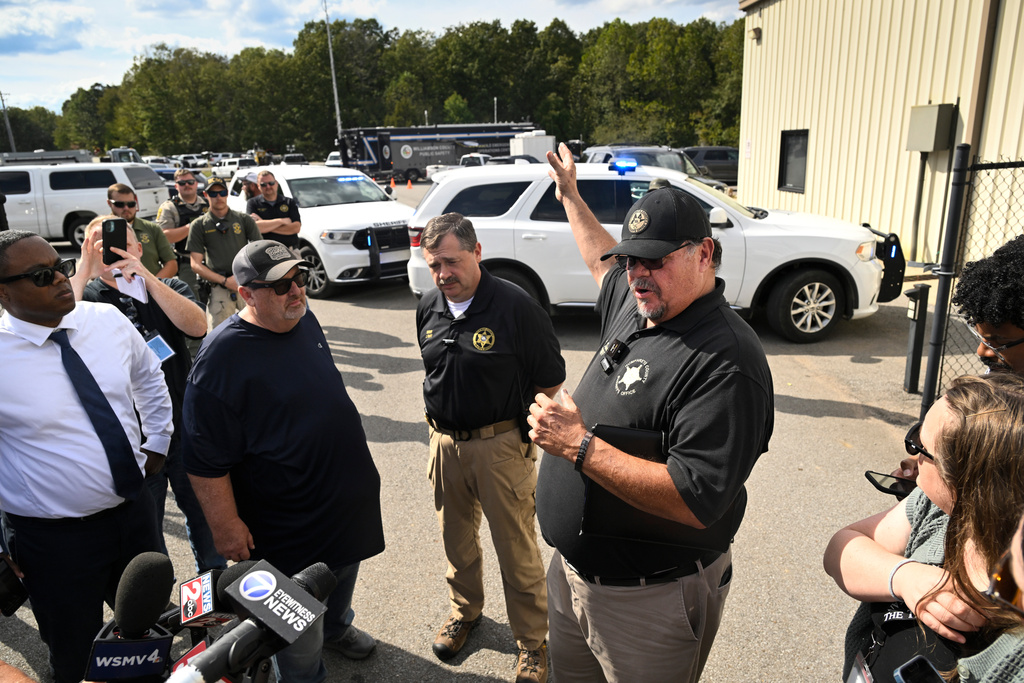 Humphreys County Sheriff Chris Davis, right, stands next to Hickman County Sheriff J. Craft as they address the press during a news conference at Accurate Energetic Systems, an explosives plant, after a blast resulted in multiple fatalities and others missing Friday, Oct. 10, 2025, in Bucksnort, Tenn. (AP Photo/John Amis)