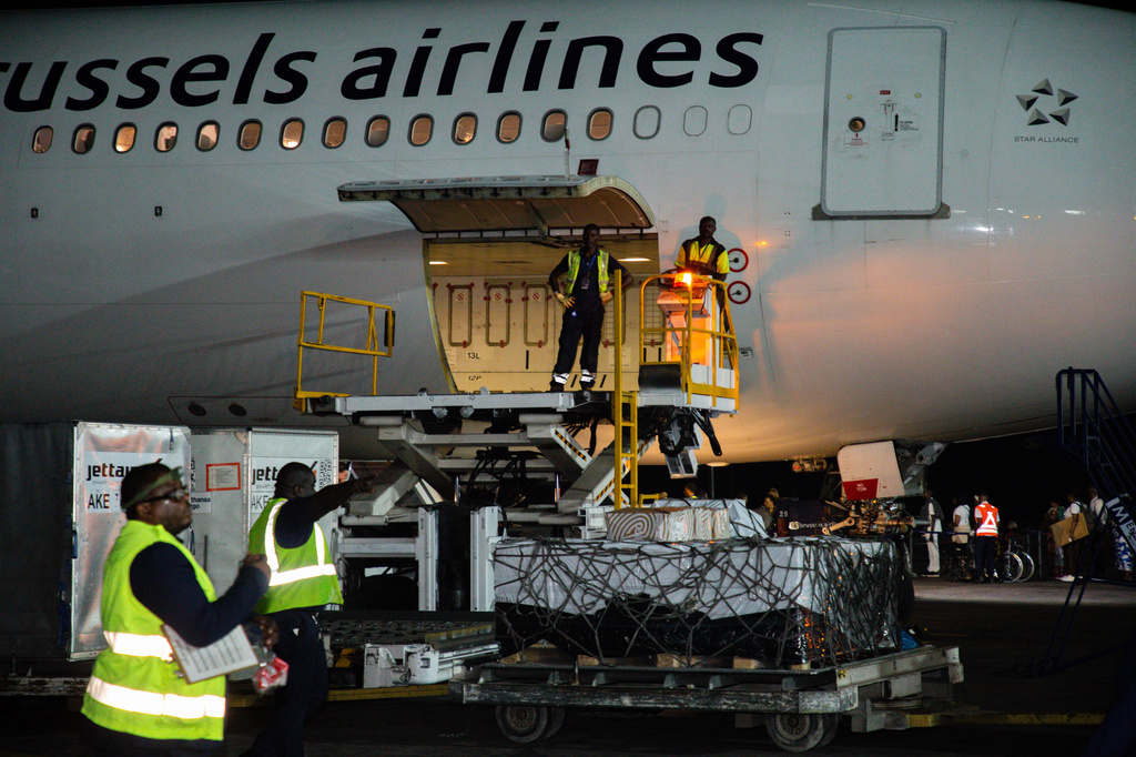 In this photo released by UNICEF, workers unload doses of Ebola (Zaire) vaccines from a plane at Ndjili International Airport in Kinshasa, Congo, Friday, Aug. 21, 2026. (Ndomba Mbikayi/UNICEF via AP)