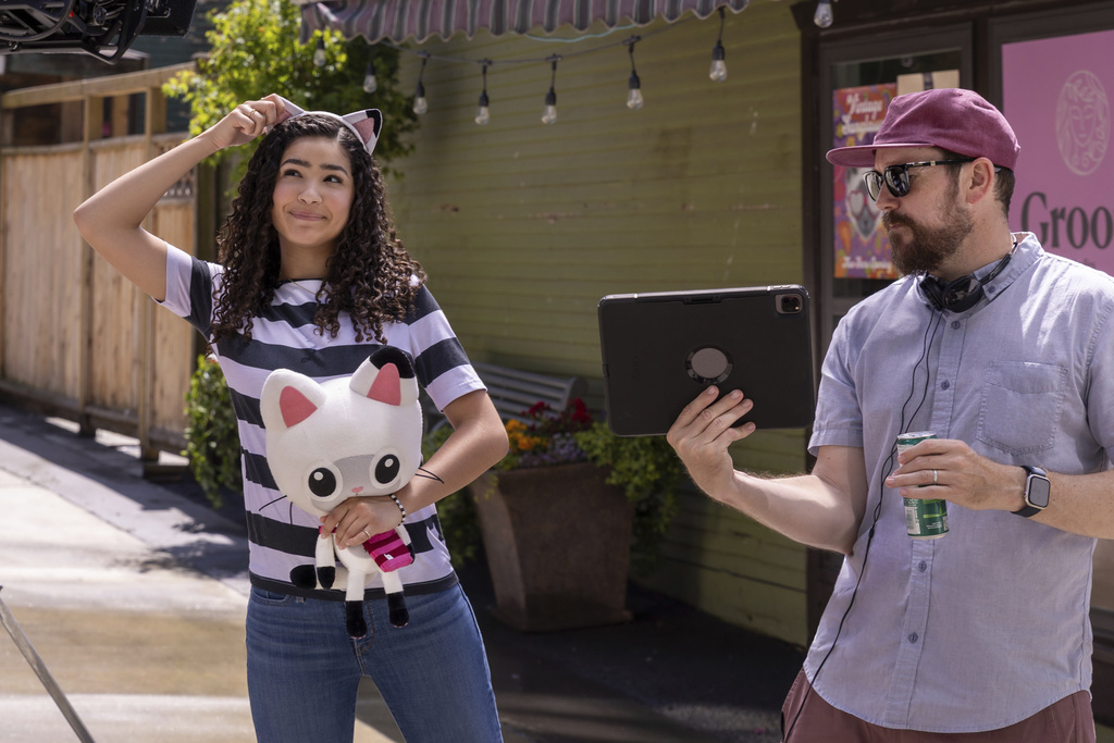 This image released by Universal Pictures shows Laila Lockhart Kraner, left, with director Ryan Crego during the filming of DreamWorks Animation's "Gabby's Dollhouse: The Movie." (Universal Pictures/DreamWorks Animation via AP)