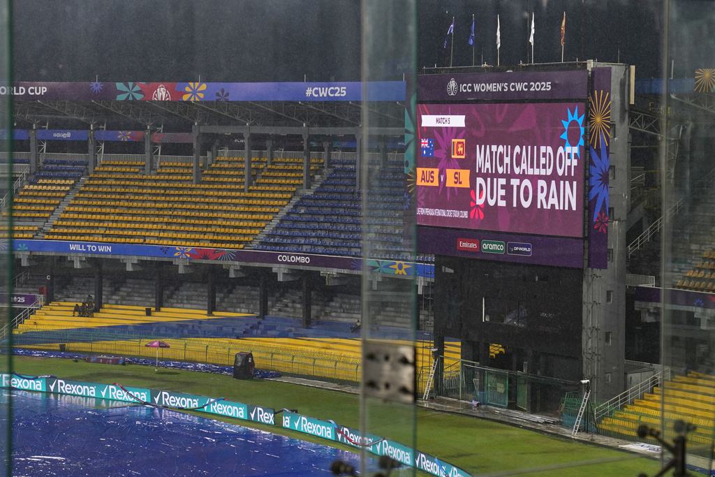 Photo shows the covered field and empty spectator stands of Premadasa Stadium after the ICC Women's Cricket World Cup match between Australia and Sri Lanka was called off due to rain in Colombo, Sri Lanka, on Saturday, October 4, 2025. ( AP Photo/ Eranga Jayawardena)