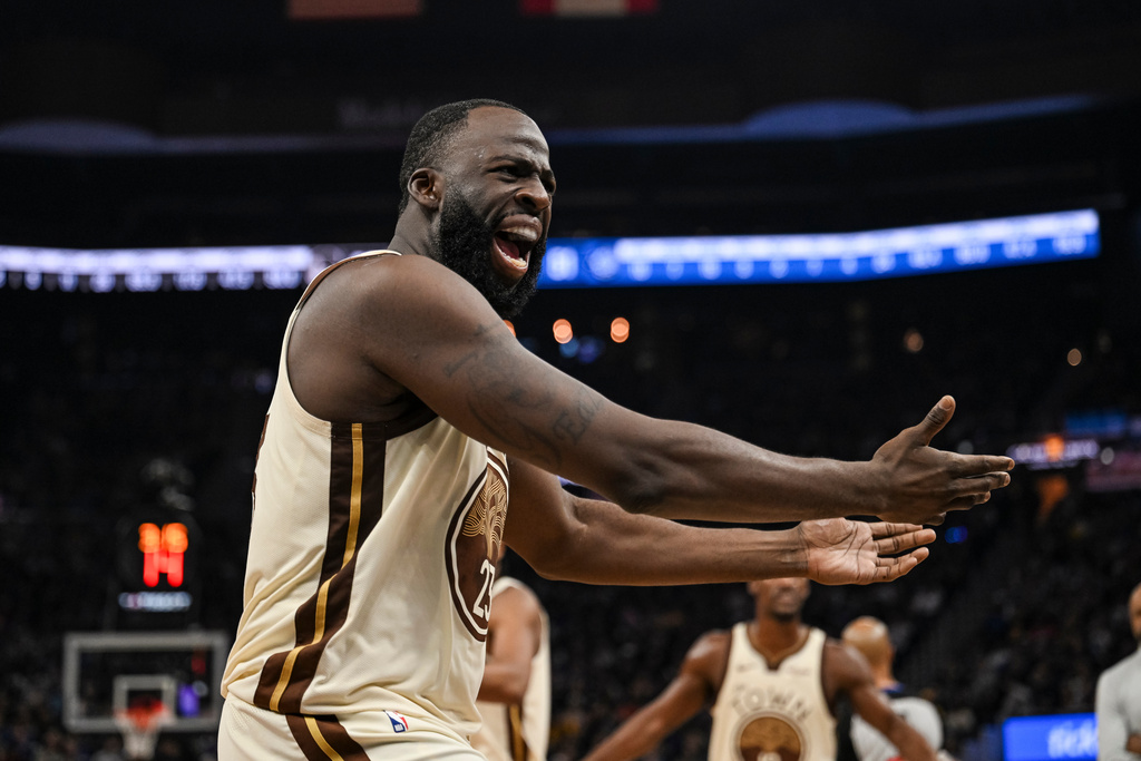 Golden State Warriors forward Draymond Green yells at the referee during the first half of an NBA basketball game against the Orlando Magic, Monday, Dec. 22, 2025, in San Francisco (AP Photo/Justine Willard)