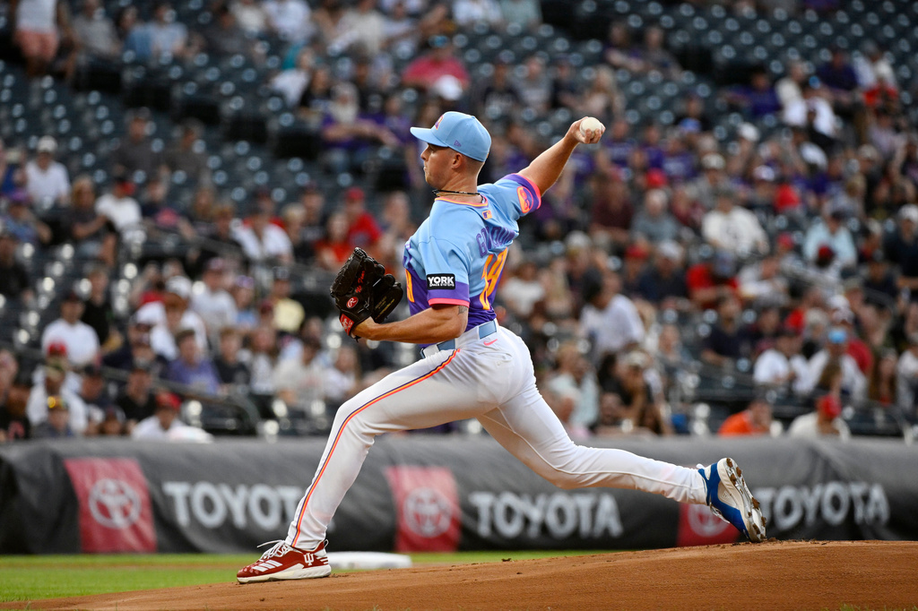Colorado Rockies starting pitcher Tanner Gordon throws in the first inning of a baseball game against the Cleveland Guardians, Friday, Aug. 21, 2026, in Denver. (AP Photo/Geneva Heffernan)