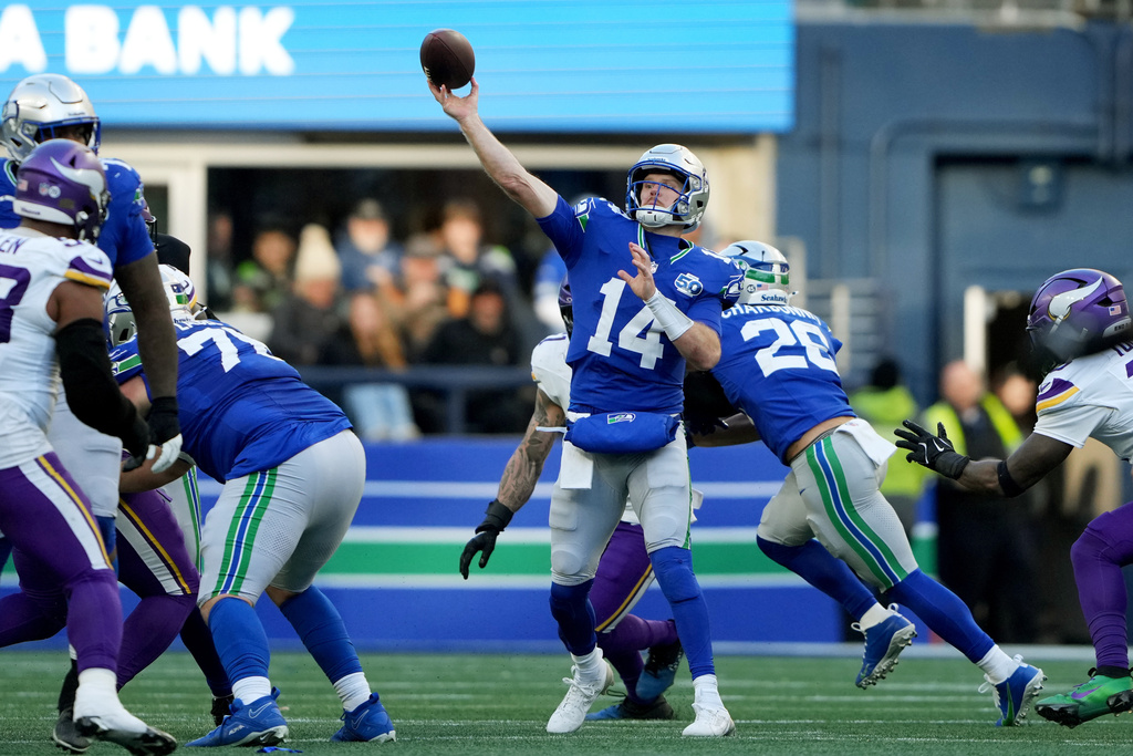 Seattle Seahawks quarterback Sam Darnold (14) passes against the Minnesota Vikings during the second half of an NFL football game, Sunday, Nov. 30, 2025, in Seattle. (AP Photo/Lindsey Wasson)