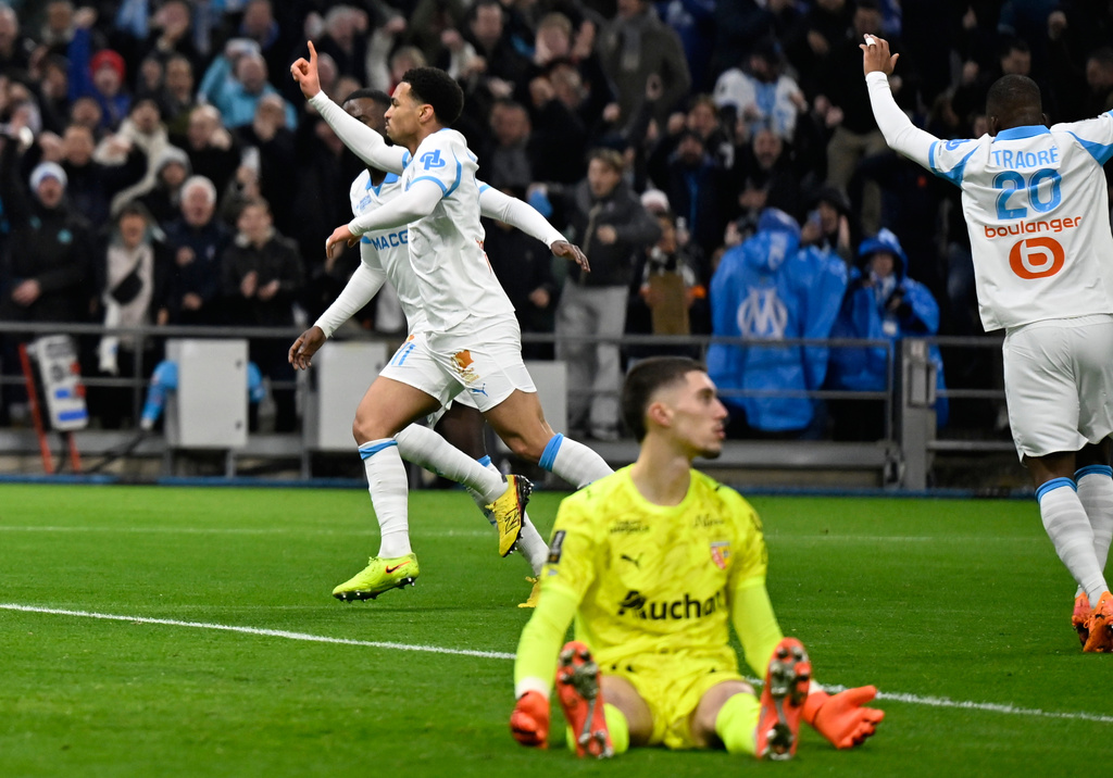 Marseille's Ethan Nwaneri celebrates as his teammate Marseille's Amine Gouiri scores his side's second goal during the French League One soccer match between Marseille and Lens in Marseille, France, Saturday, Jan. 24, 2026. (AP Photo/Philippe Magoni)