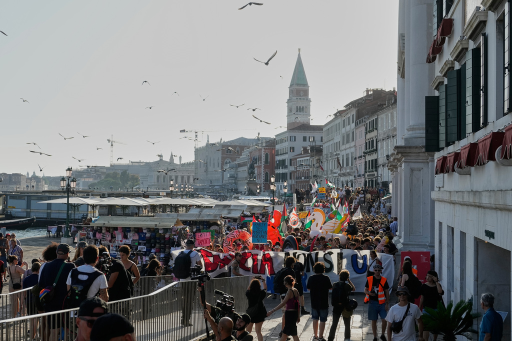 Demonstrators gather to protest against U.S. Ambassador Tilman Fertitta's luxury yacht 'Boardwalk" presence in Venice, Friday, July 17, 2026. (AP Photo/Luca Bruno)