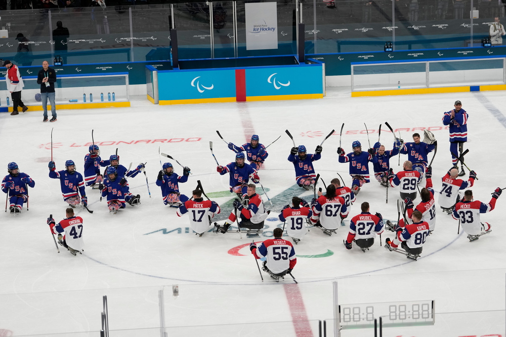 United States players celebrate after winning a semifinal hockey match against Czech Republic at the 2026 Winter Paralympics, in Milan, Italy, Friday, March 13, 2026. (AP Photo/Luca Bruno)