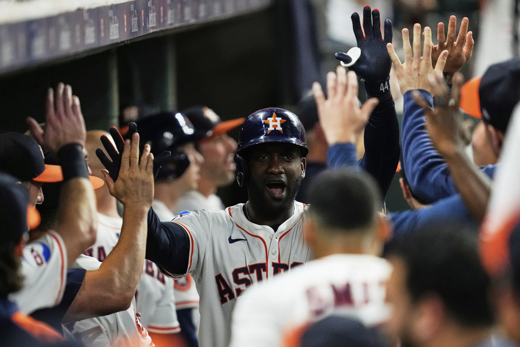 Houston Astros designated hitter Yordan Alvarez celebrates after hitting a home run during the eighth inning of a baseball game against the Colorado Rockies in Houston, Wednesday, Aug. 27, 2025. (AP Photo/Ashley Landis)