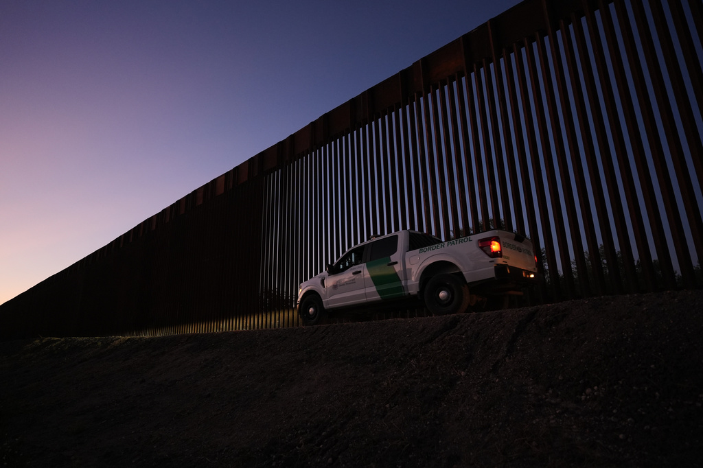 A U.S. Border Patrol vehicle passes a new section of border wall at the Santa Ana Wildlife Refuge in Alamo, Texas, Tuesday, Aug. 25, 2026. (AP Photo/Eric Gay)
