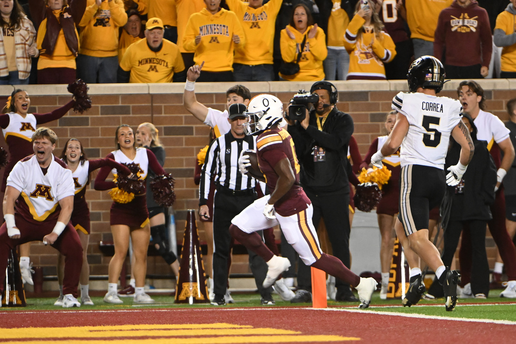 Minnesota wide receiver Lemeke Brockington (0) runs past Purdue linebacker Charles Correa (5) for a touchdown during the first half of an NCAA college football game on Saturday, Oct. 11, 2025, in Minneapolis. (AP Photo/Craig Lassig)