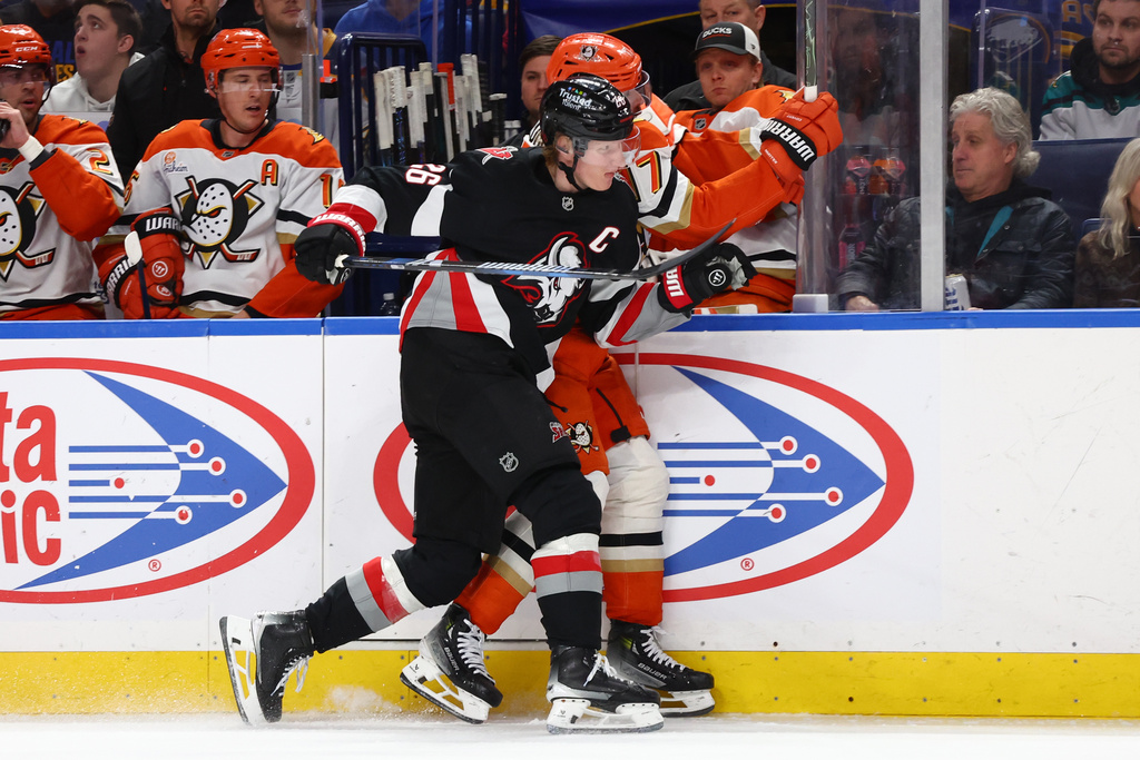Buffalo Sabres defenseman Rasmus Dahlin (26) checks Anaheim Ducks left wing Alex Killorn (17) into the boards during the second period of an NHL hockey game Saturday, Jan. 10, 2026, in Buffalo, N.Y. (AP Photo/Jeffrey T. Barnes)