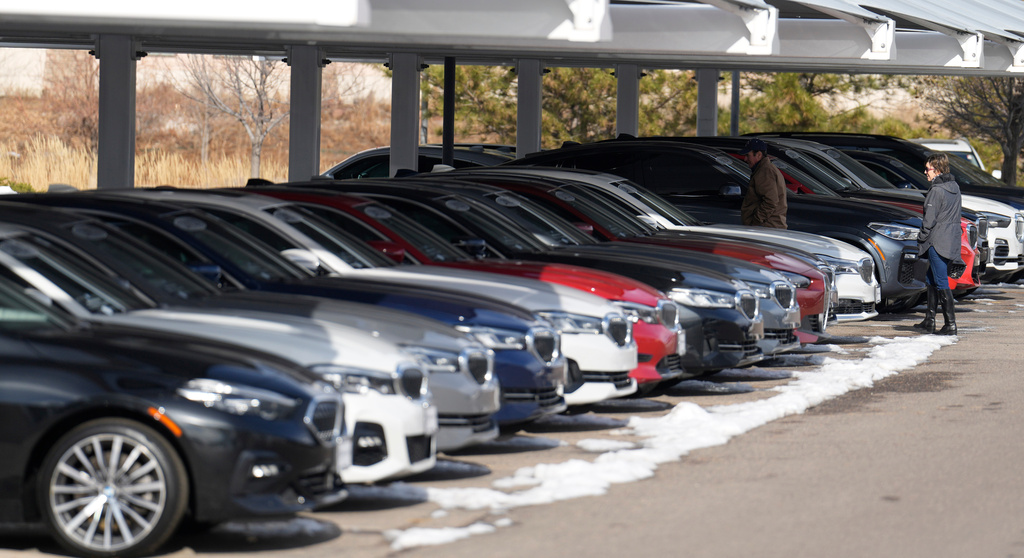 FILE - Unsold 2023 and 2024 models sit on display outside a BMW dealership on Thursday, Nov. 30, 2023, in Loveland, Colo. (AP Photo/David Zalubowski, File)