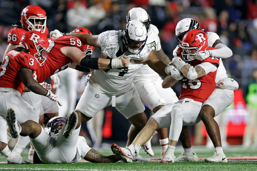 Rutgers quarterback Athan Kaliakmanis, front right, is sacked by Oregon linebacker Dylan Williams, back right, during the second half of an NCAA college football game Saturday, Oct. 18, 2025, in Piscataway, N.J. (AP Photo/Adam Hunger) Rutgers quarterback Athan Kaliakmanis, front right, is sacked by Oregon linebacker Dylan Williams, back right, during the second half of an NCAA college football game Saturday, Oct. 18, 2025, in Piscataway, N.J. (AP Photo/Adam Hunger)