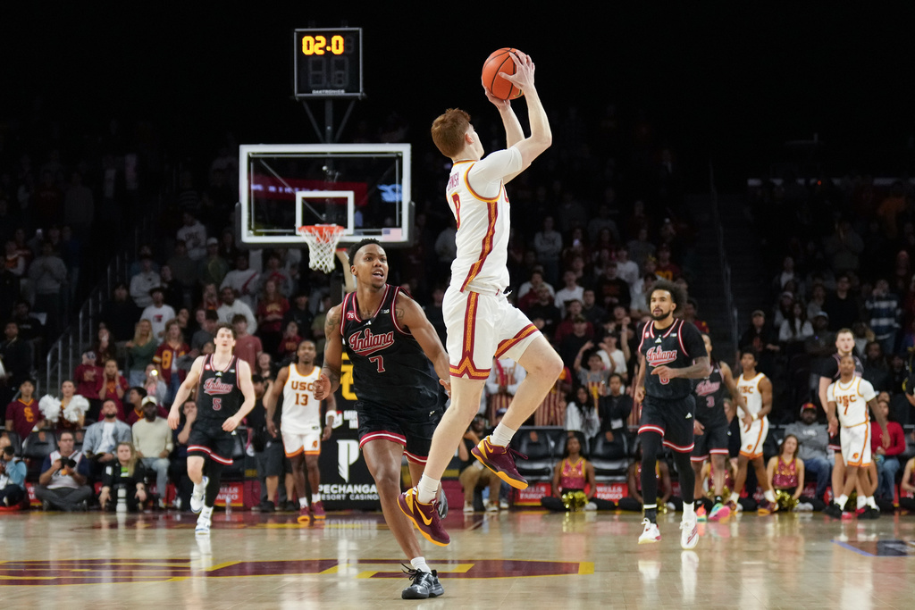 Southern California guard Ryan Cornish (9) grabs a rebound against Indiana forward Nick Dorn (7) during the second half of an NCAA college basketball game in Los Angeles, Tuesday, Feb. 3, 2026. (AP Photo/Jae C. Hong)